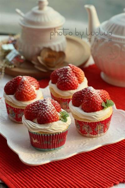 A small paper cup of strawberry cream