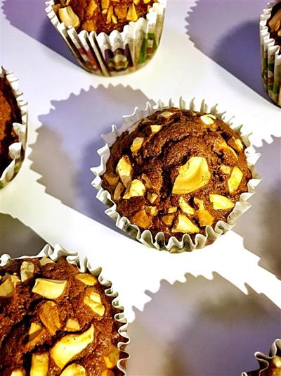 Cocoa paper cup cake with cashews