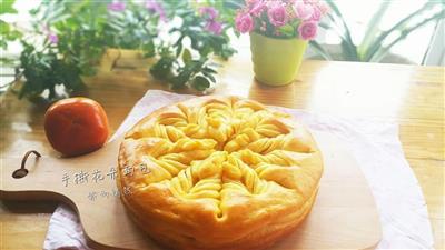 Pumpkin hand tearing flower bread