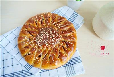 Hand-tearing strawberry jam and twisted bread