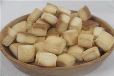 A casual snack - a square cookie with milk